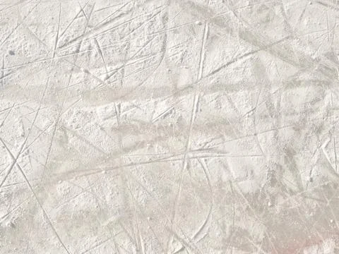 Ice background with marks from skating and hockey. Stock Photos