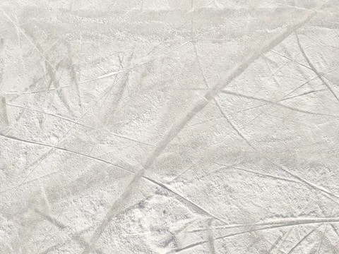 Ice background with marks from skating and hockey. Stock Photos