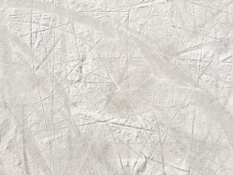 Ice background with marks from skating and hockey. Stock Photos