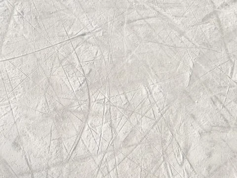Ice background with marks from skating and hockey. Stock Photos