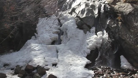 Ice at base of falls Stock Footage 73650657