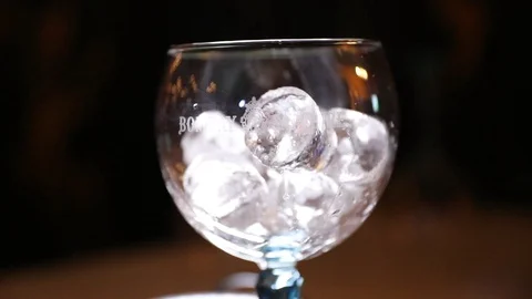 Ice being added to Glass Stock Footage 102009743