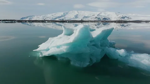 Ice berg floating in front of a glacier 4K 50FPS Stock Footage 218271424