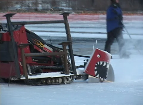 Ice Block harvest 2, crew cuts and saws thick ice to float to shore Stock Footage 296194058