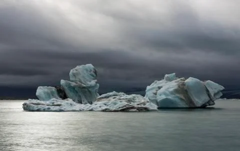 Ice Blocks and dark Clouds at the Jokulsarlon Lake, Iceland Stock Photos