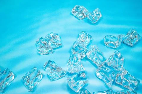 Ice on blue background Stock Photos