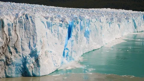 Ice breaking off a glacier in slow-mo Stock-Footage 125773220