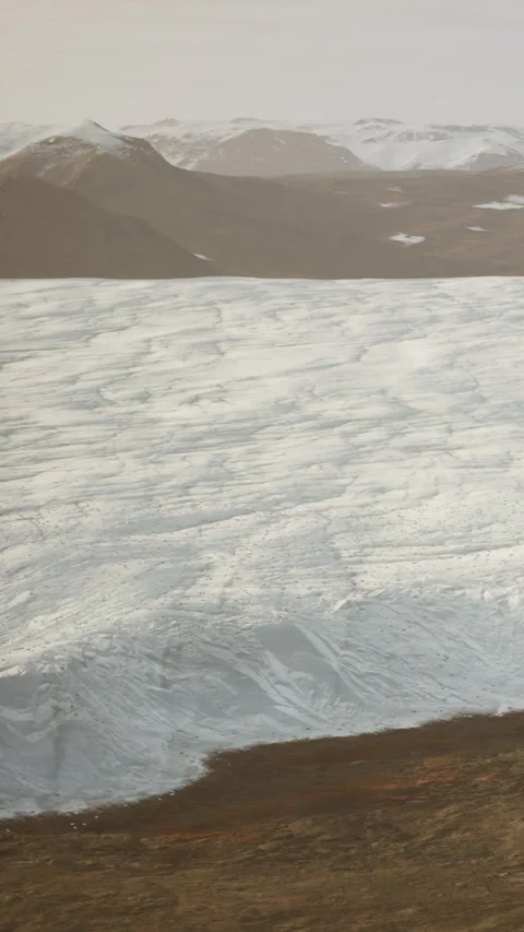 Ice cap covers mountain range in Greenland during summer season Stock Footage 341983240