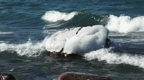 Ice capped boulder HD Stock Footage 10826707