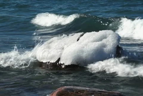 Ice capped boulder NTSC Stock Footage 10826703