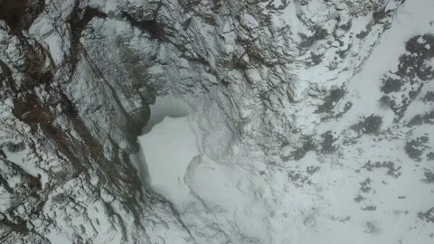 Ice cave in the mountains. View from a drone. Video stock 151670859