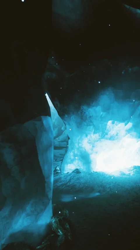 Ice cave shows bright light entering through openings during daytime Stock Footage 332205169