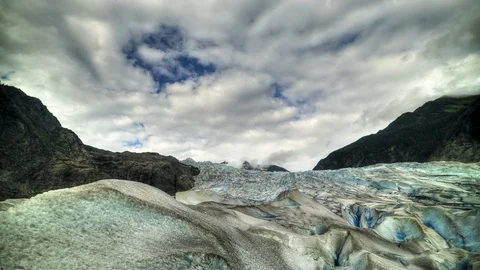 Ice cave time-lapse with a cloudy sky Stock Footage 111728024