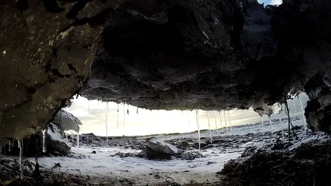 Ice cave on the water under the bridge in Eyrarbakki Iceland Stock Footage 118276492