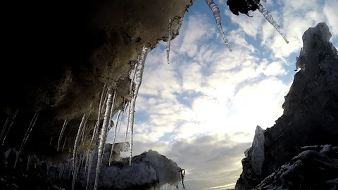 Ice cave on the water under the bridge in Eyrarbakki Iceland Stock Footage 118276661