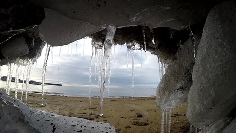 Ice cave on the water under the bridge in Eyrarbakki Iceland Stock Footage 118276989