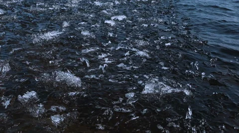 Ice chips floating in clean spring river Stock Footage 62312877