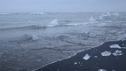 Ice chunks on black sand beach Stock Footage 124825198