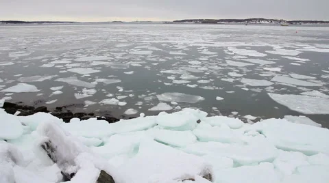 Ice chunks float through ocean harbor, Portland Maine Stock Footage 47087147