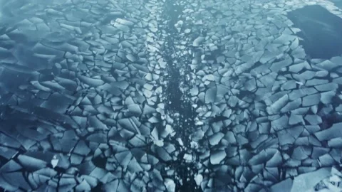 Ice chunks floating down a river in the middle of winter Stock Footage 226913851