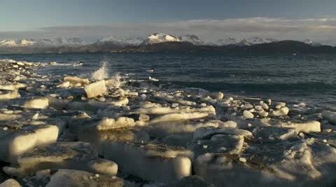 Ice Chunks on Lands End Beach Waves and Kenai Mountains in Alaska Stock Footage 12720959