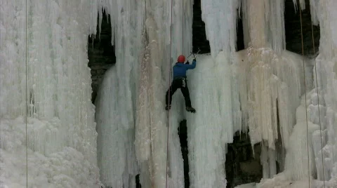 Ice climber exploring cave Video stock 313588