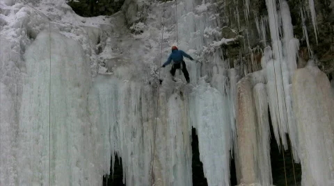 Ice climber repels down Stock Footage 313638