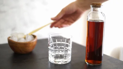 İce coffee on the black table Stock Footage 92353579