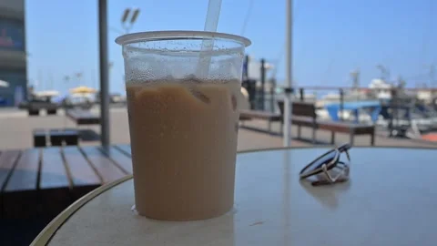 Ice coffee. Cold coffee. Espresso with ice cubes and milk  Stock Footage 314243044