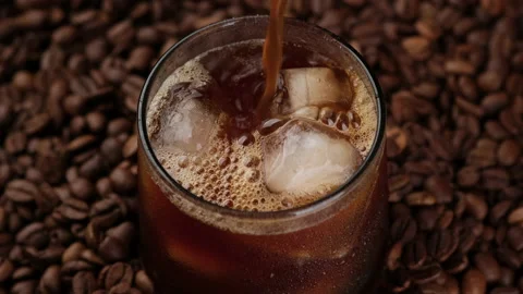 Ice coffee drinks for summer. Pouring coffee in glass with ice Video stock 201238391