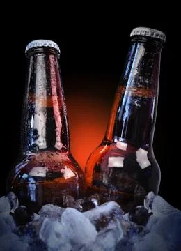 Ice cold class beer bottles on black Stock Photos