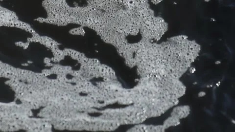 Ice-Cold Flow - Late Winter River Flowing Through the riverbed Stock Footage 331098239