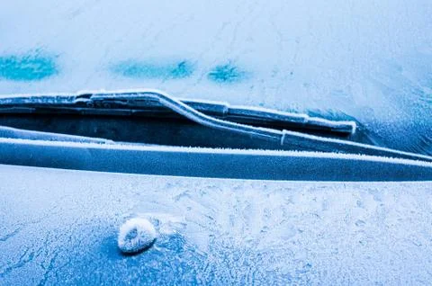 The ice-cold frost forms ice crystals in beautiful unique patterns on the Car Stock Photos