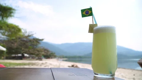 Ice cold lime lemonade with Brazilian flag at the beach Stock-Footage 80393883