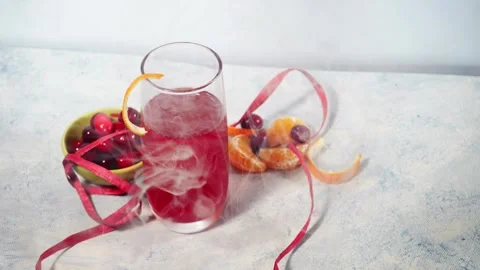 Ice cold red ripe cranberry and orange drink Stock Footage 325448937