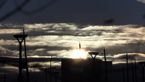 Ice cold winter day with sun and clouds moving in the freezing sky Stock Footage 119939923