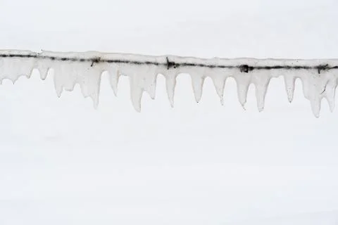 Ice covered barb wire Stock Photos