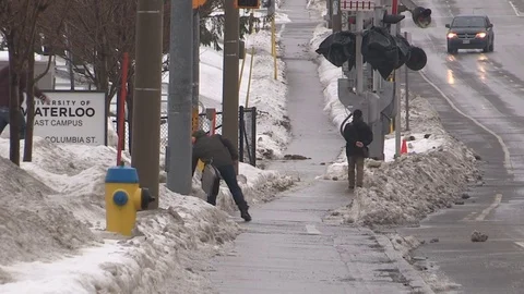 Ice covered city sidewalks after freezing rain storm Stock Footage 70976149