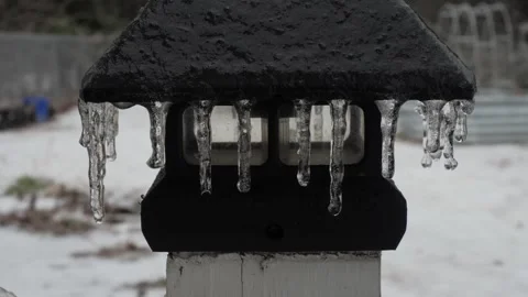 Ice Covered Light on Railing During Freezing Storm Stock Footage 327725238