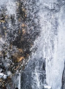 Ice covered rock, background Stock Photos