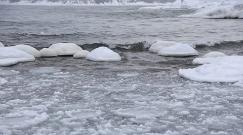 Ice covered rocks in the waves Stock Footage 37216901