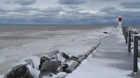 Ice covered small pier, small lighthouse, Great Lakes WInter Stock Footage 34284123