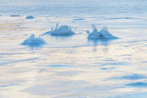 Ice crack patterns on the surface of a frozen lake, Lofoten Norw Stock Photos