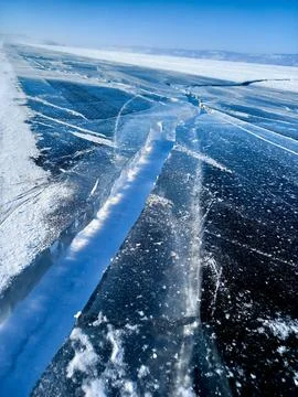 Ice cracks in the snow Stock Photos