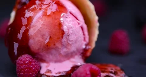 Ice cream and raspberry jam closeup, berry flavored ice cream and fresh sweet Stock Footage 299207016