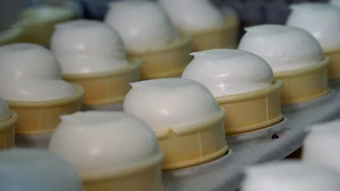 Ice-cream automatic production line. Filling of wafer cups with ice cream. Ice Stock Footage 120472953