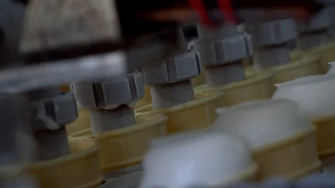 Ice-cream automatic production line. Filling of wafer cups with ice cream. Ice Stock Footage 120473033