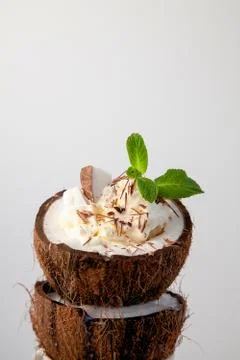 Ice cream in coconut shell on white background Stock Photos