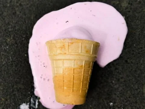 Ice cream cone falling down. Stock Photos