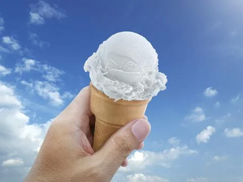 Ice cream cone rising to the hot summer sky Stock Photos